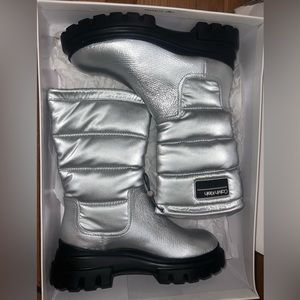 Calvin Klein Women’s Winter Boots, silver and shiny.